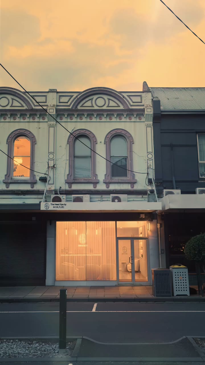 The Hikari storefront on Station Street at dusk, its front windows glowing warm